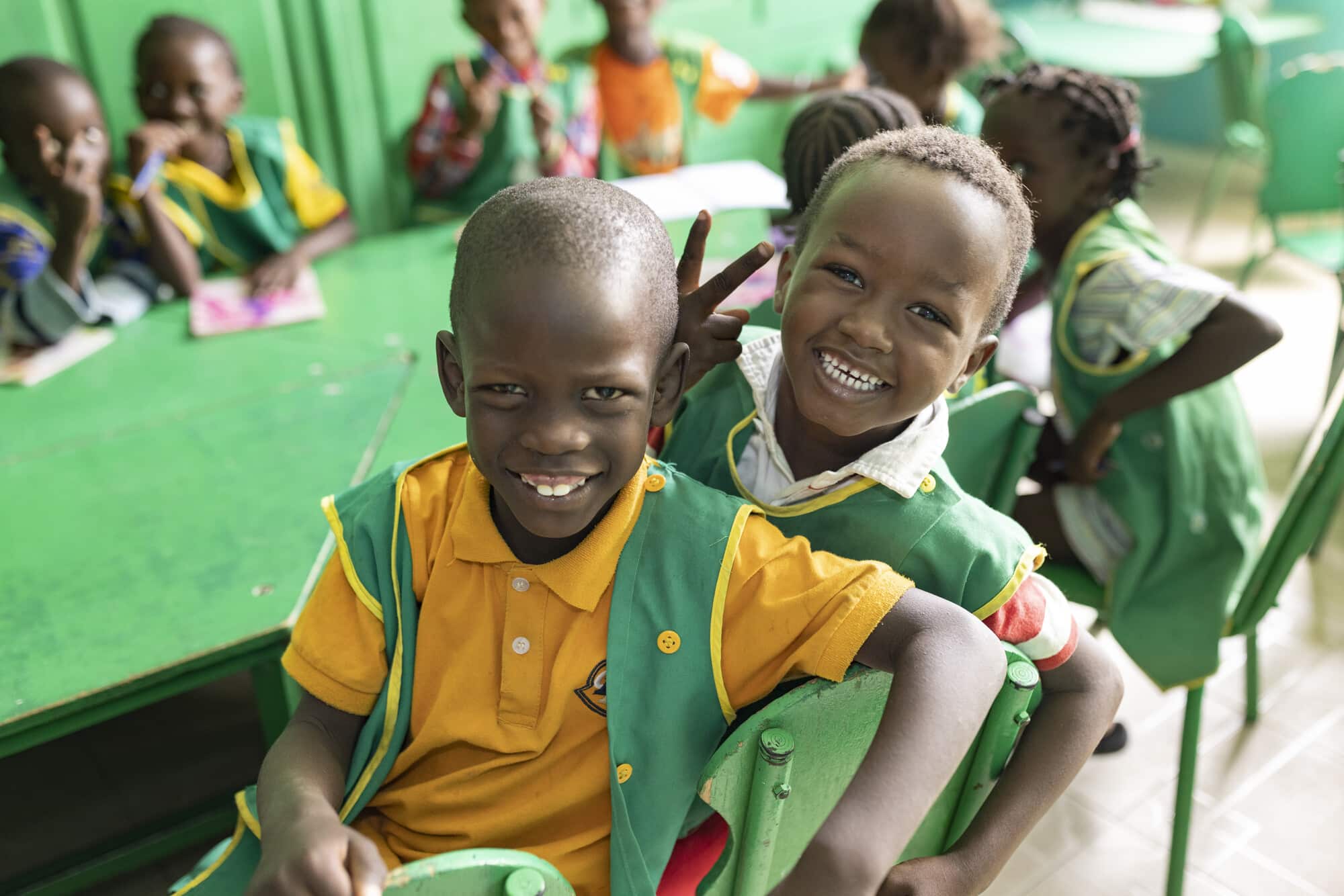 Abdallah (5, L) and Alassane (5, R) sit together at a ChildFund-supported ECD center in Ziguinchor Region, Senegal.

“Tell me what your childhood was like, I’ll tell you who you are. It is here that the children develop their confidence, their abilities, health outcomes and intelligence. This is what we foster,” says ECD director Maimouna Fall.

Ziguinchor Region, Senegal, West Africa.
March 15, 2022. 
Photo by Jake Lyell for ChildFund.
